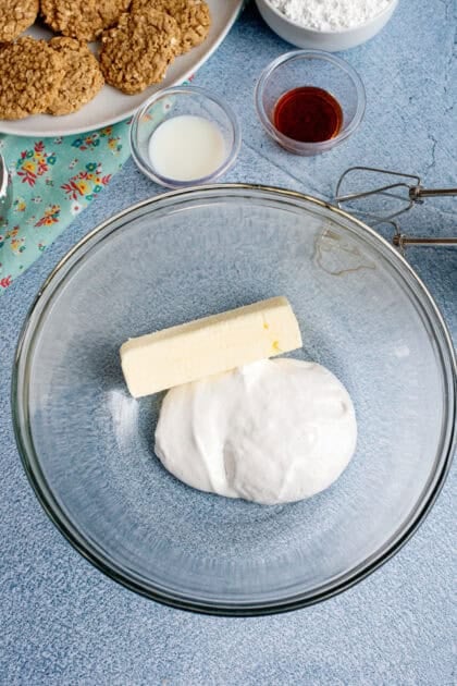 Ingredients for oatmeal cream pie filling in a class bowl.