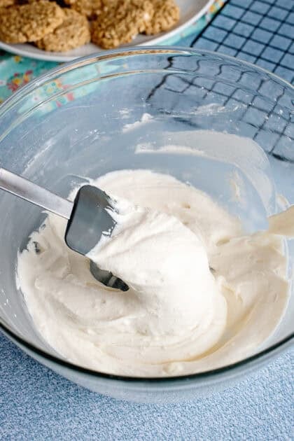 Mixing the oatmeal cream pie filling in a glass bowl.