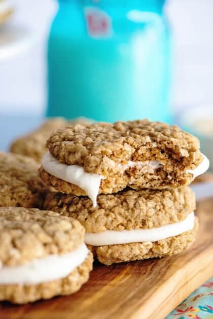Oatmeal cream pies with a bite taken out of one of them.