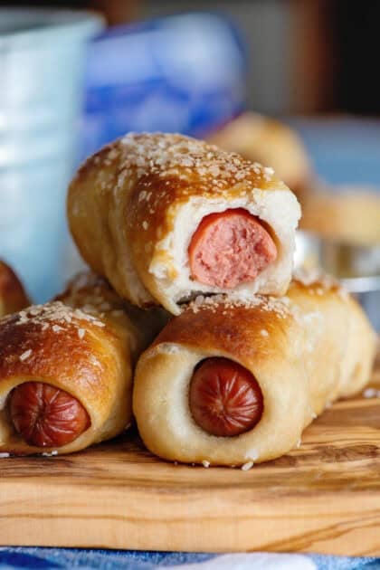 A stack of juicy and delicious pretzel dogs.