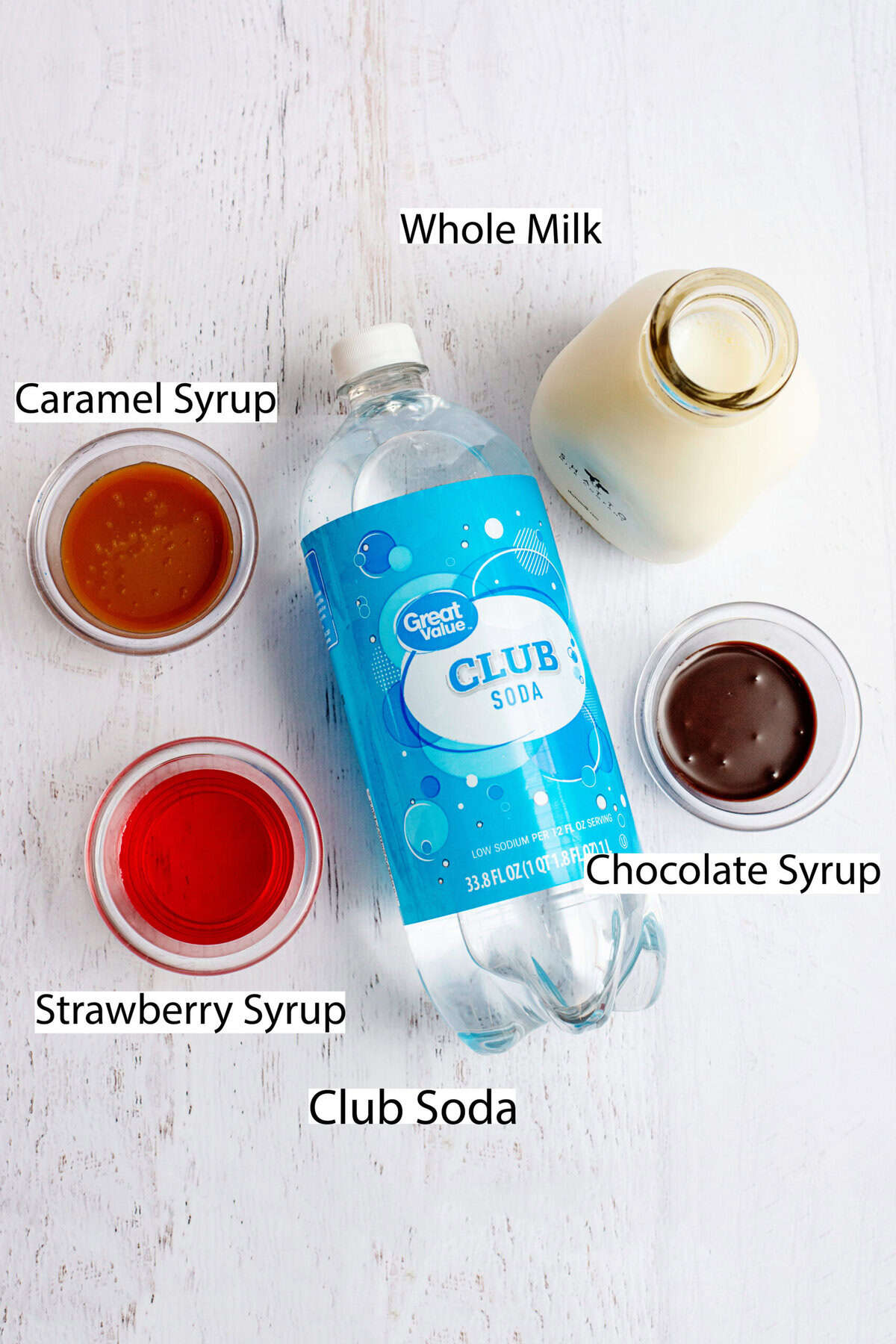 Ingredients for egg cream on a marble surface.