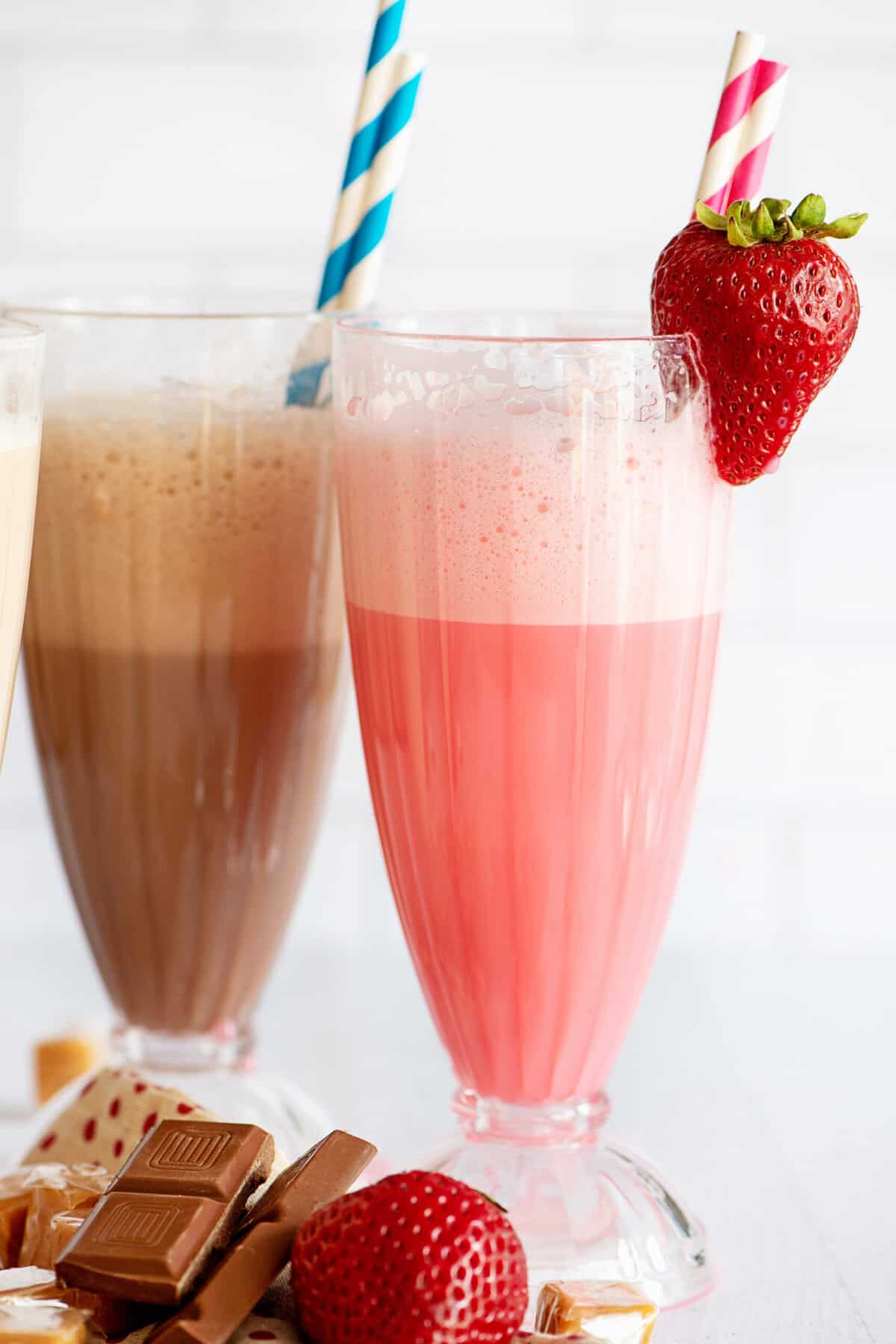 Strawberry and chocolate egg cream in decorative glasses.