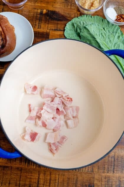 Bacon sizzling in a Dutch oven.