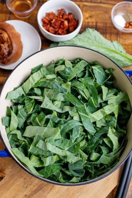 Freshly chopped collard greens in a Dutch oven.