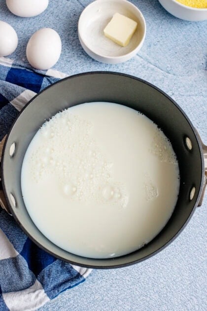 Milk in a pot for Southern spoonbread recipe.