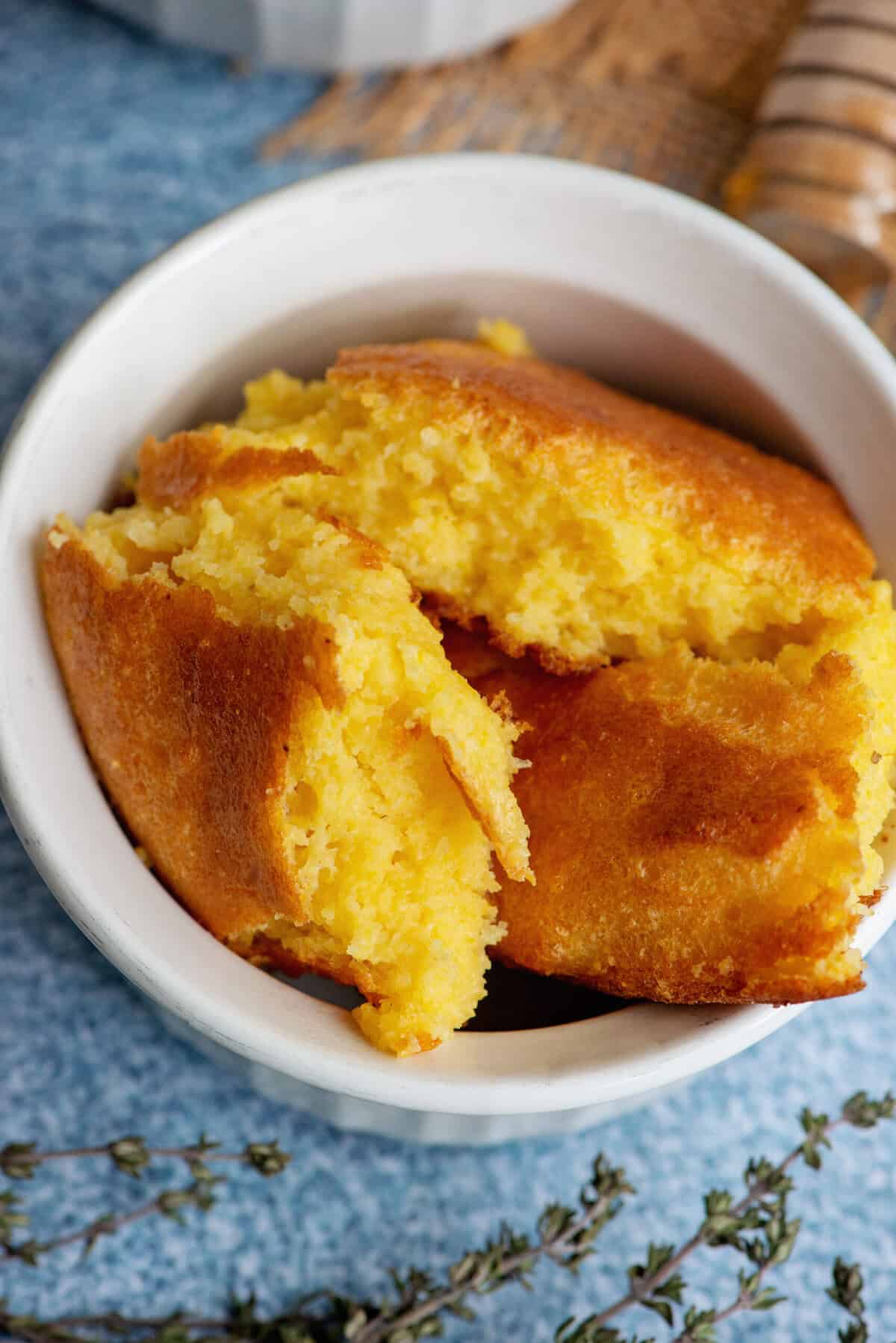 Fluffy Southern spoonbread in a white baking dish.