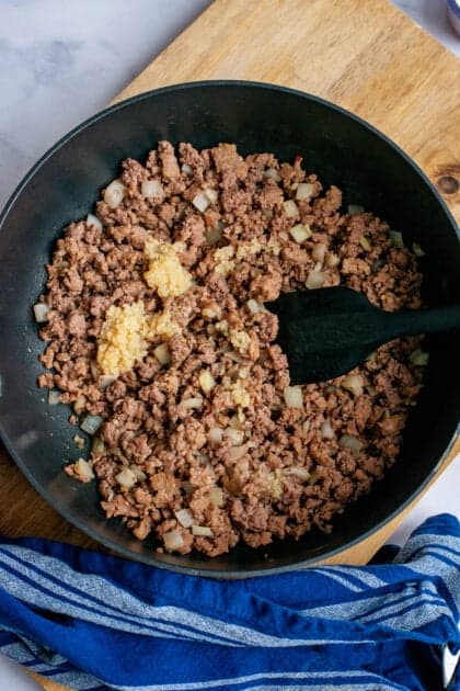 Browning the beef in a skillet.
