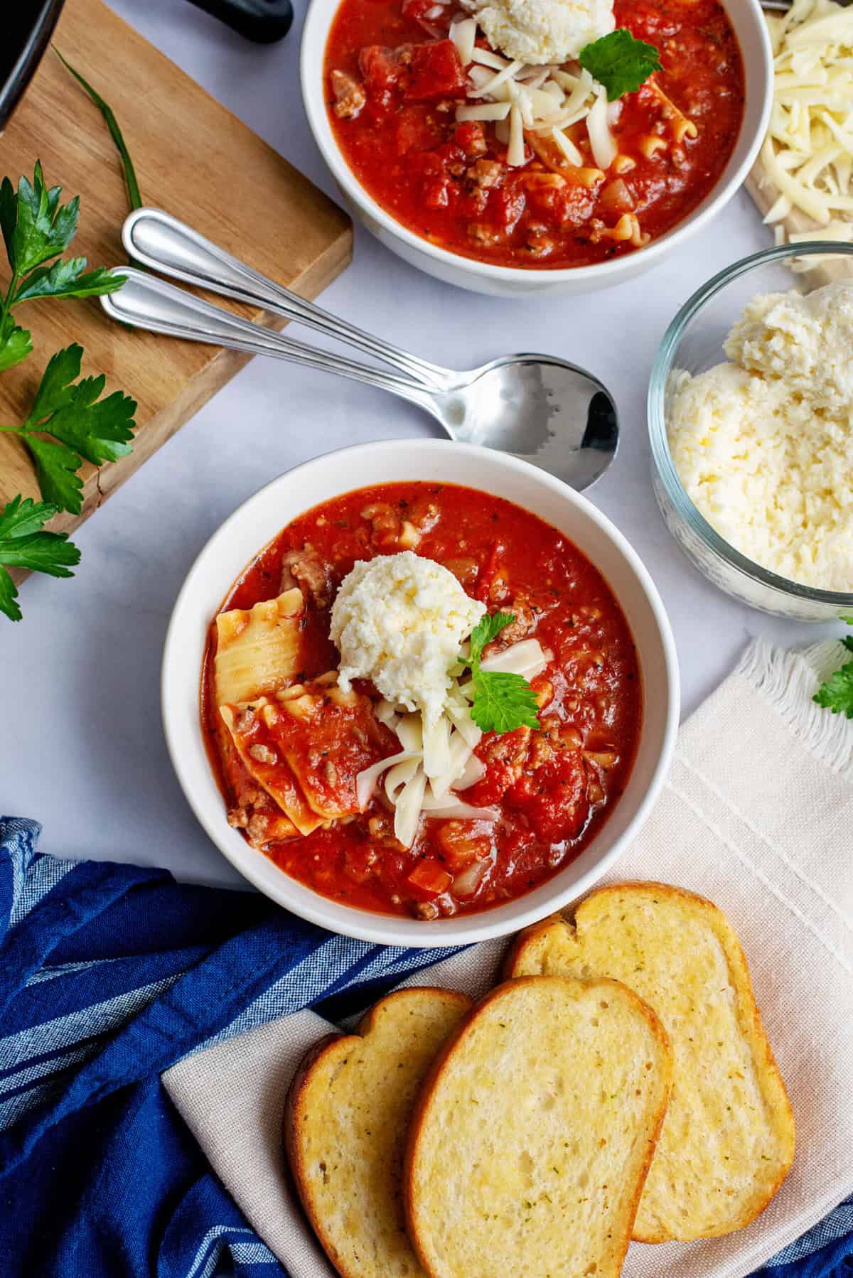 A white bowl of crockpot lasagna soup.