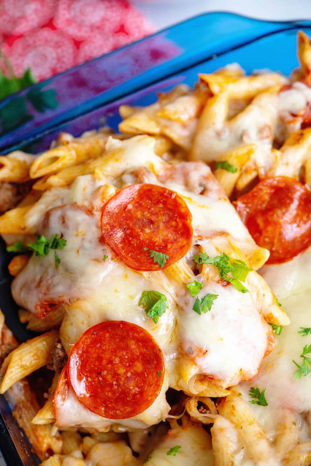 Pizza pasta casserole with gooey cheese.