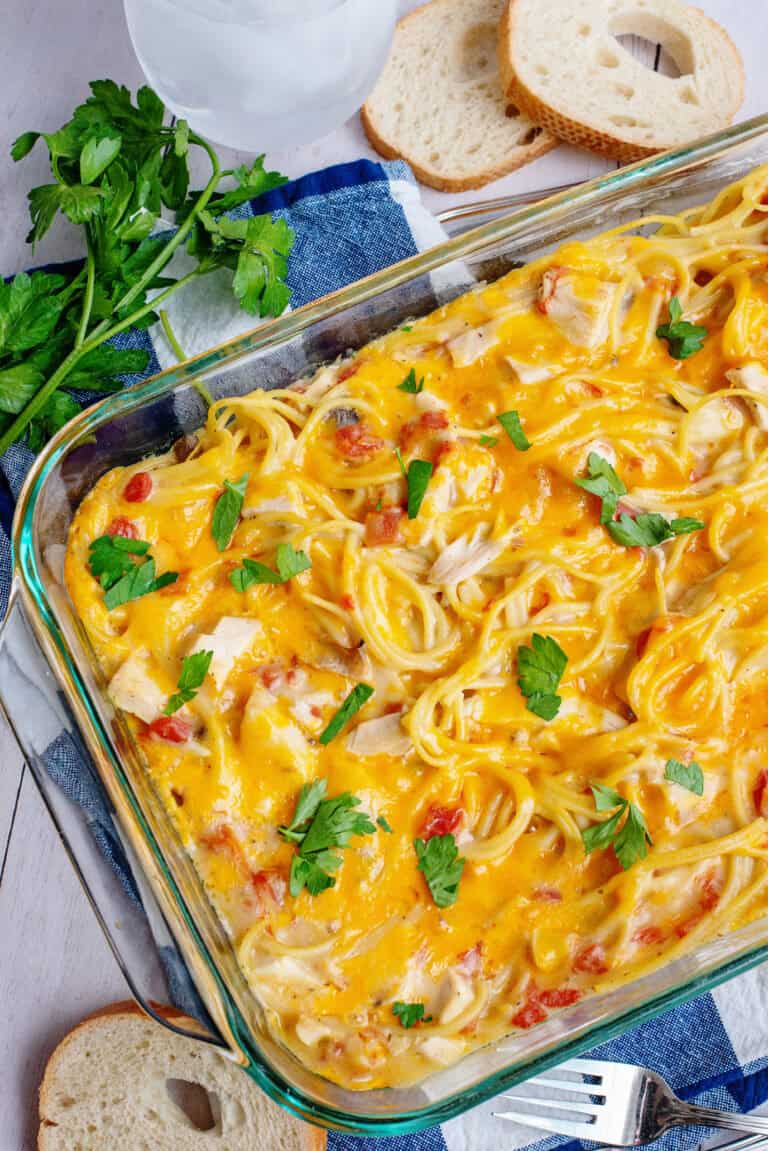 Cheesy chicken spaghetti in a casserole dish.