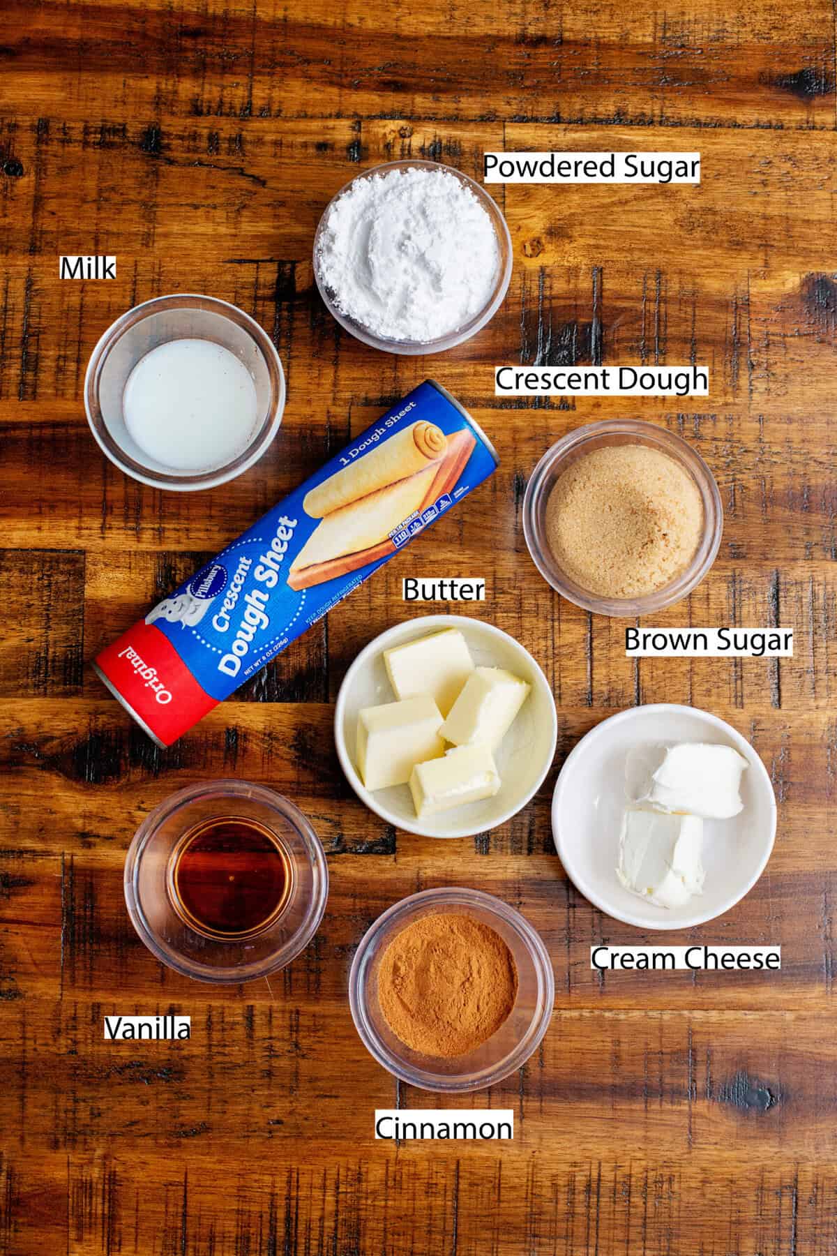 Ingredients for cinnamon sugar dessert pizza with labels.