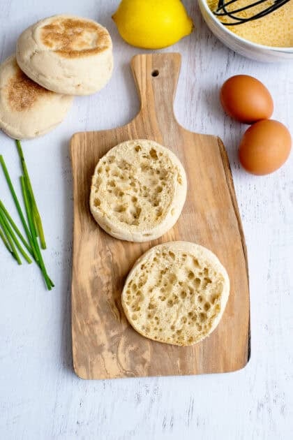 2 toasted English muffin halves on a serving board