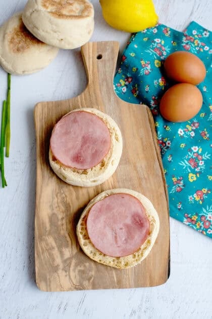 Canadian bacon on top of English muffin halves