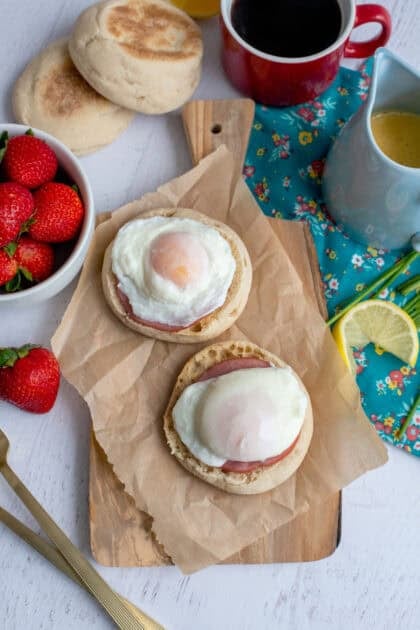 Poached eggs on top of Canadian Bacon and English muffin halves