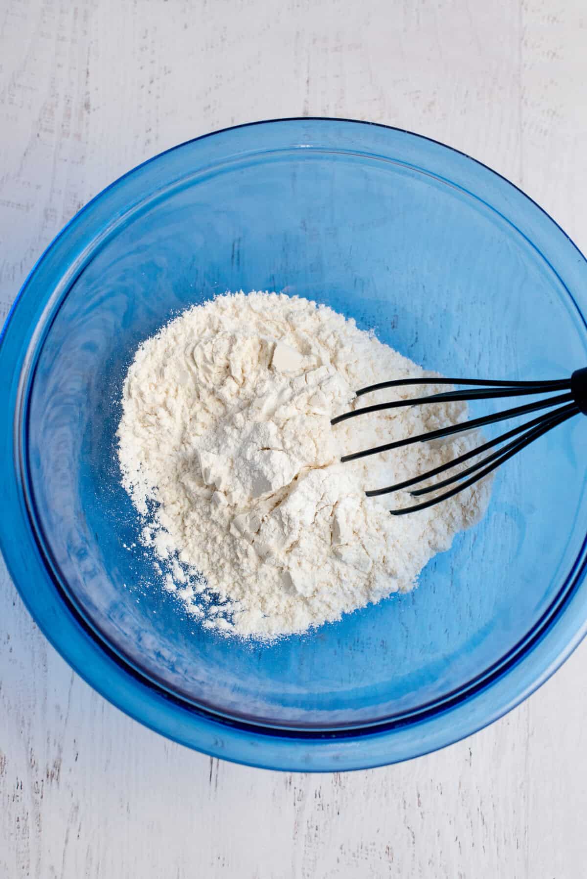 Mixing the brownie batter ingredients flour, baking powder, and salt