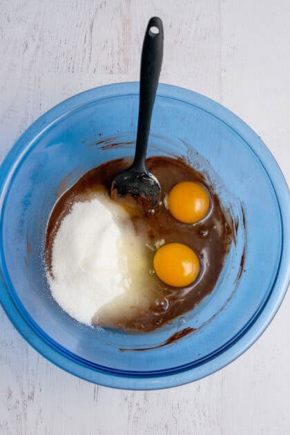 Marble brownie mixture with 2 eggs, sugar, and vanilla added