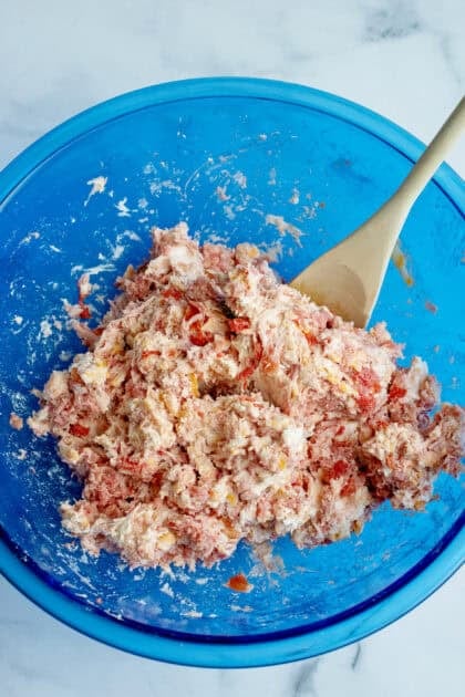 Ingredients for Rotel cream cheese sausage balls mixed together in a bowl