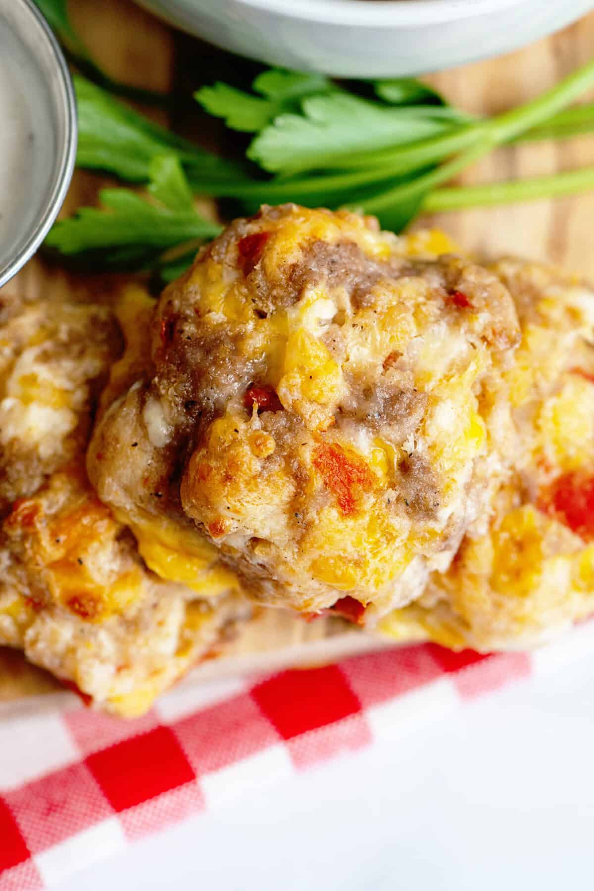 Close up of Rotel cream cheese sausage ball with some garnish