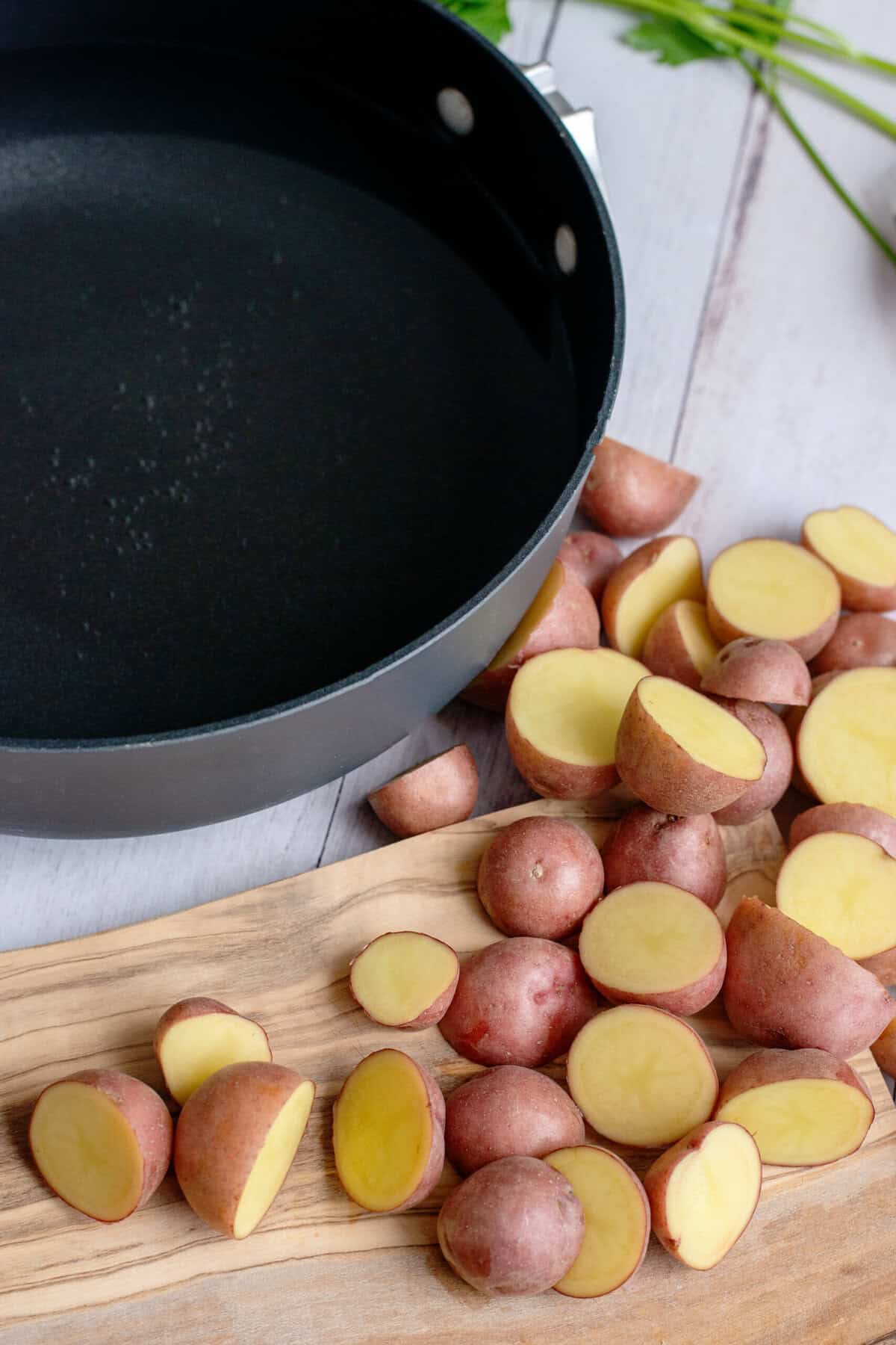 Red potato halves prepared for parboiling
