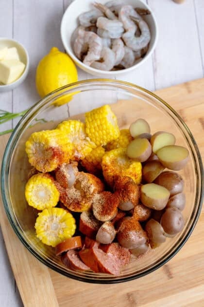 Corn, red potatoes, and sausages in bowl