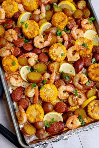 Roasted sheet pan low country seafood boil topped with garnish