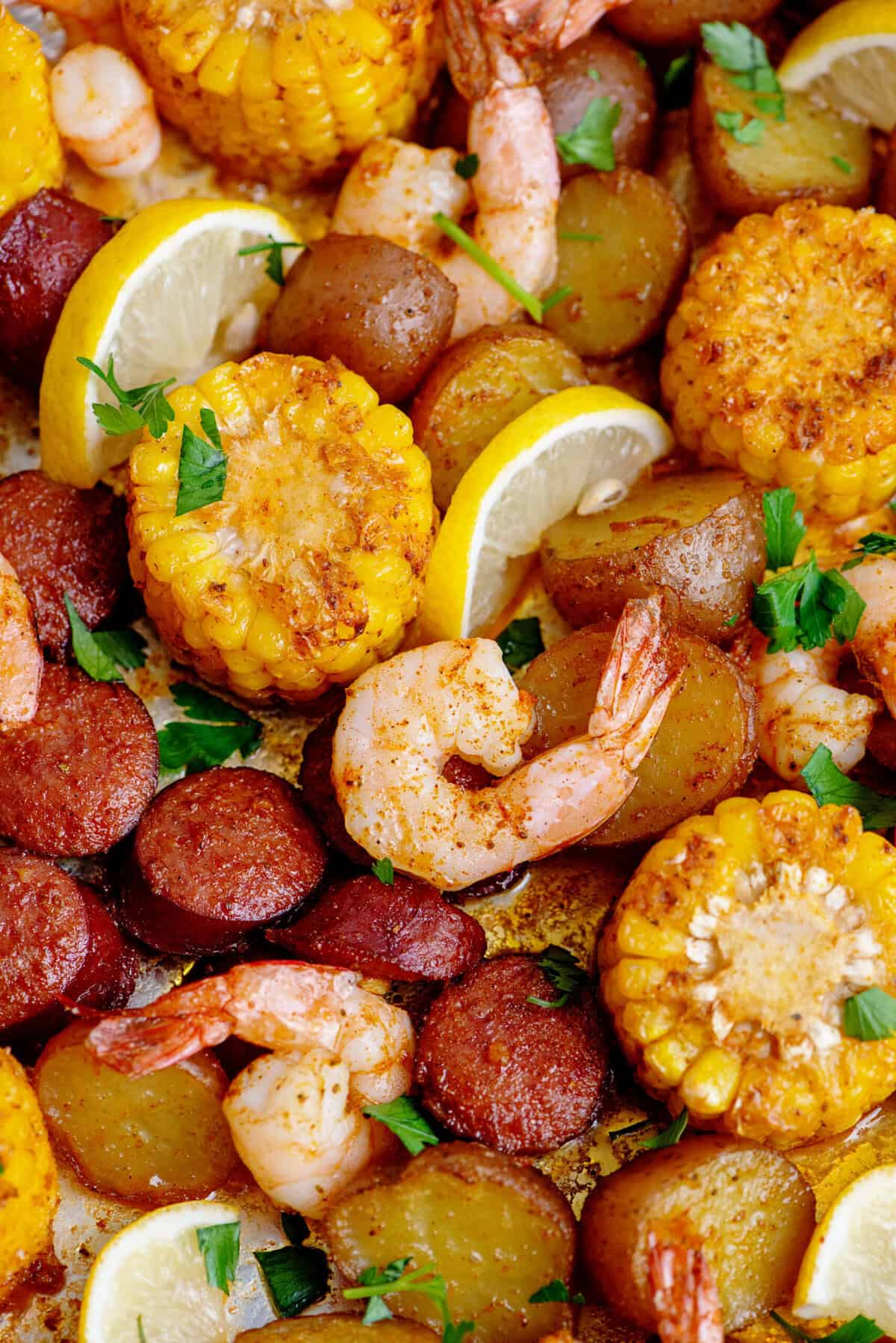 Close up of seafood boil shrimp, potatoes, and corn