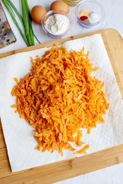 Grated sweet potatoes on a paper towel