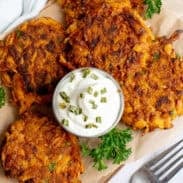 Plate of sweet potato fritters with dipping sauce