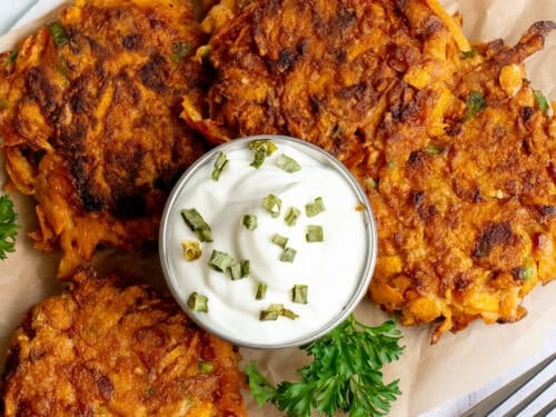 Plate of sweet potato fritters with dipping sauce