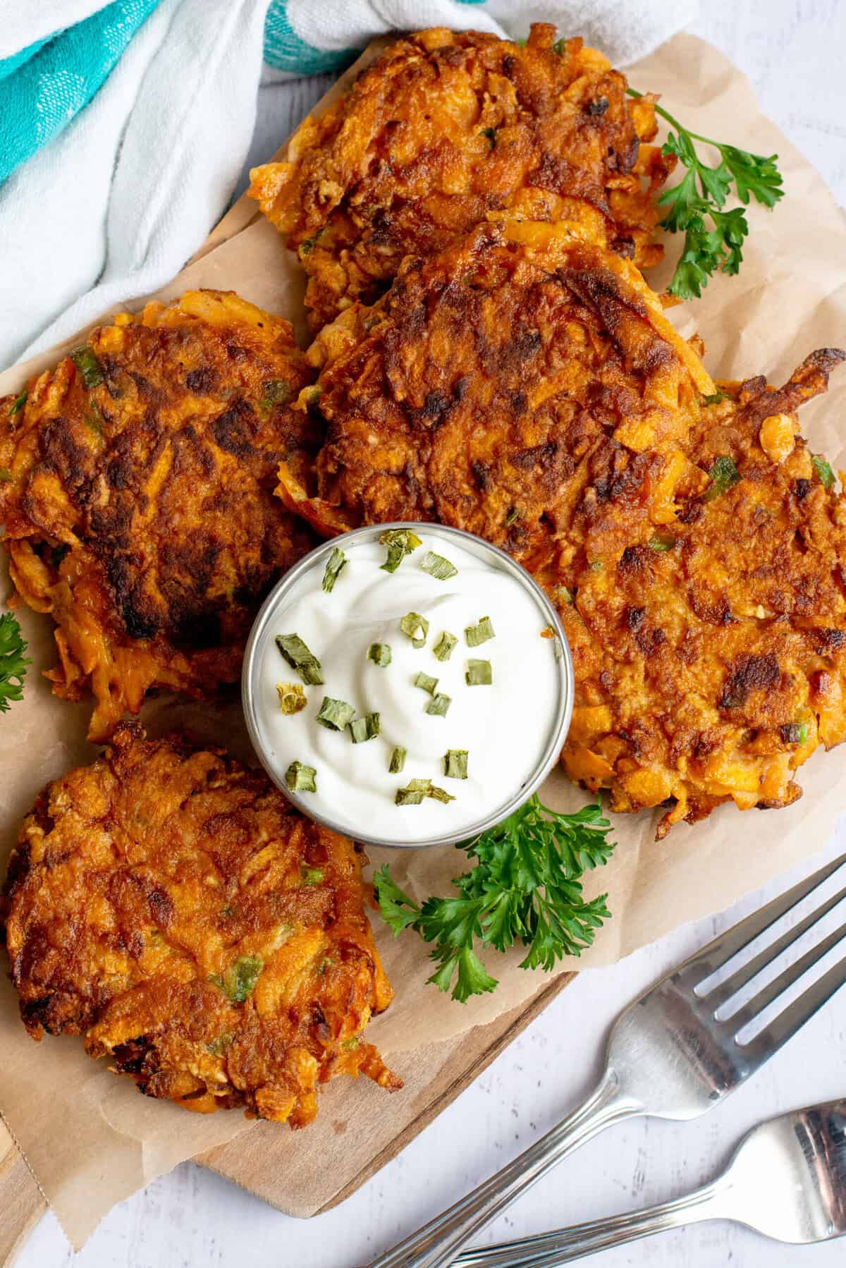 Plate of sweet potato fritters with dipping sauce