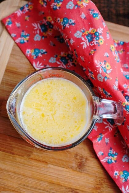 Cup of meled margarine, beaten egg, and evaporated milk