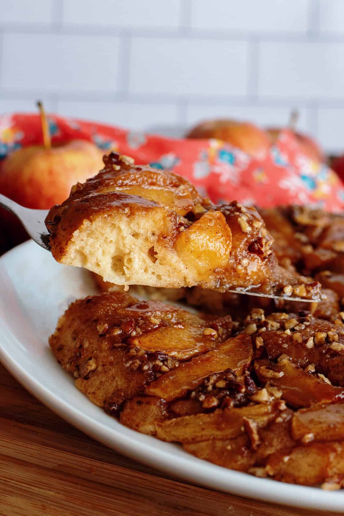 A slice of apple skillet cake on a fork