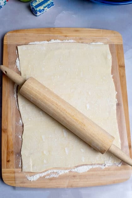 Rolling pin rolling out apple strudel dough