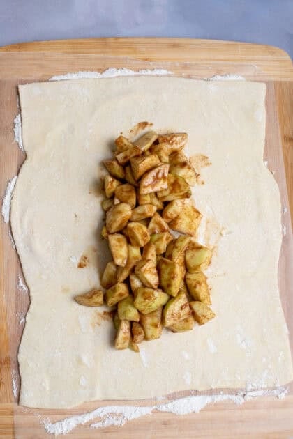 Coated apple slices on strudel dough
