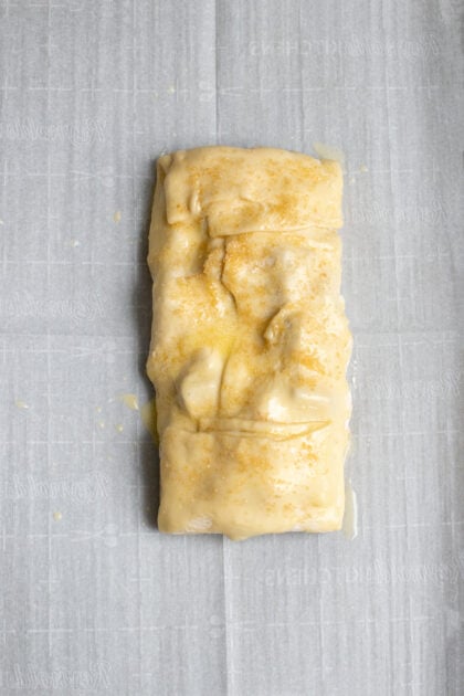 Apple strudel on parchment paper