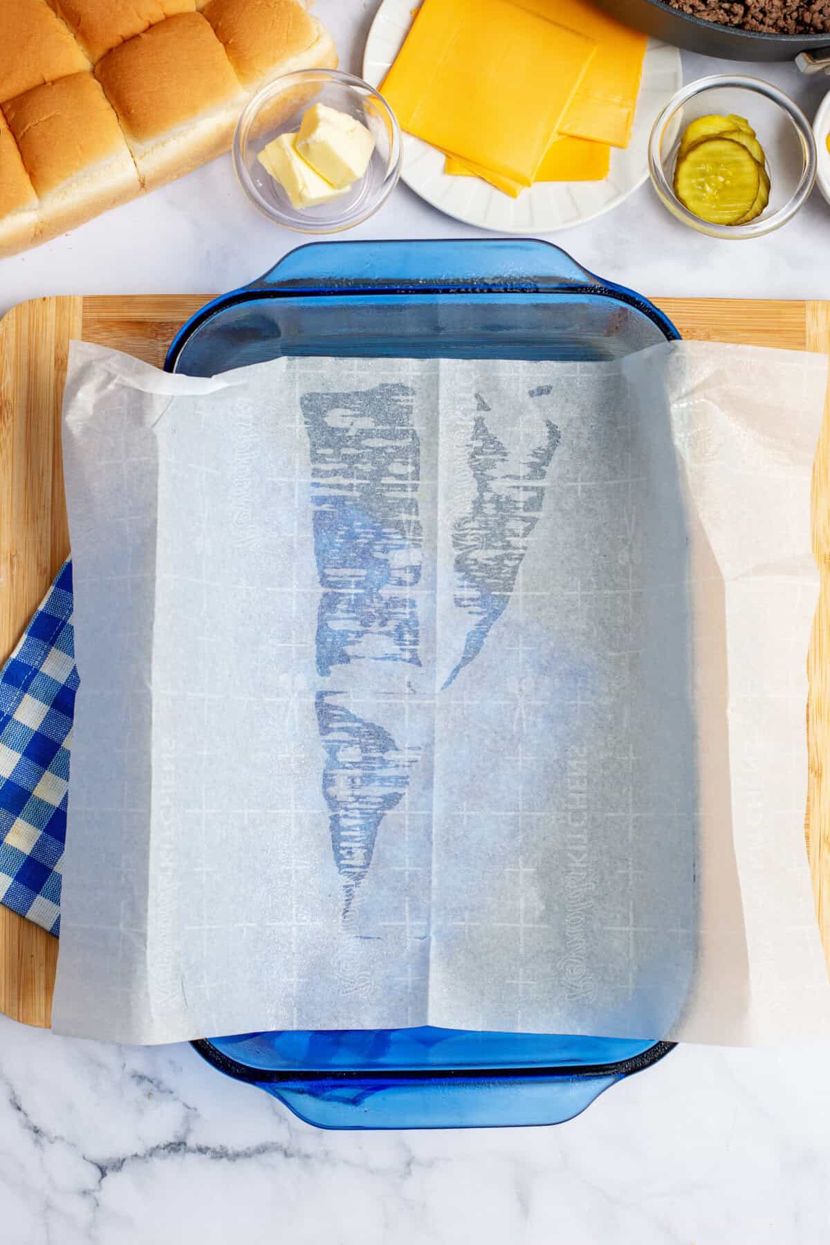 Baking sheet being lined with parchment paper