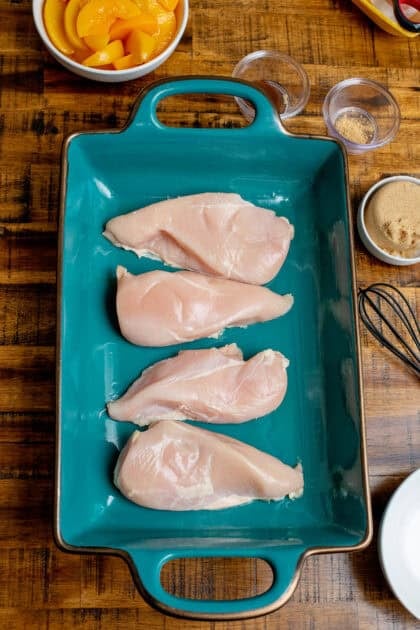raw chicken breasts in the baking pan