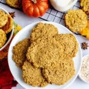 a plate of pumpkin spice oatmeal cookies