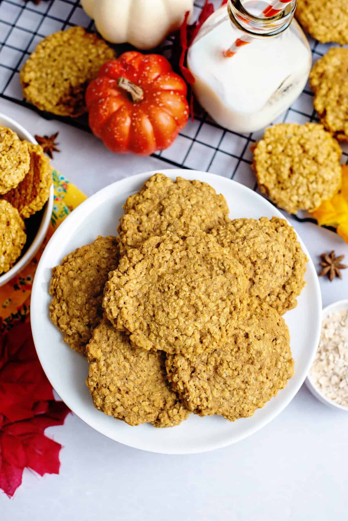 a plate of pumpkin spice oatmeal cookies