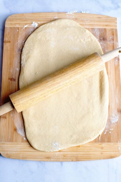 Rolling the apple cinnamon dough into a rectangle