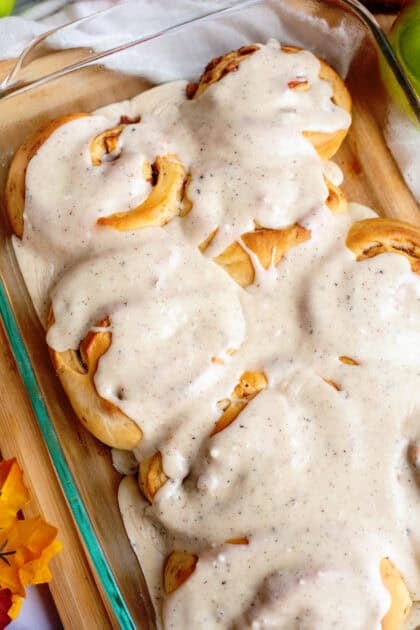 Close up of apple cinnamon rolls with brown butter maple icing