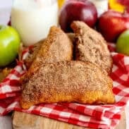 Fried apple hand pies on a serving board