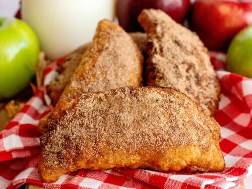 Fried apple hand pies on a serving board