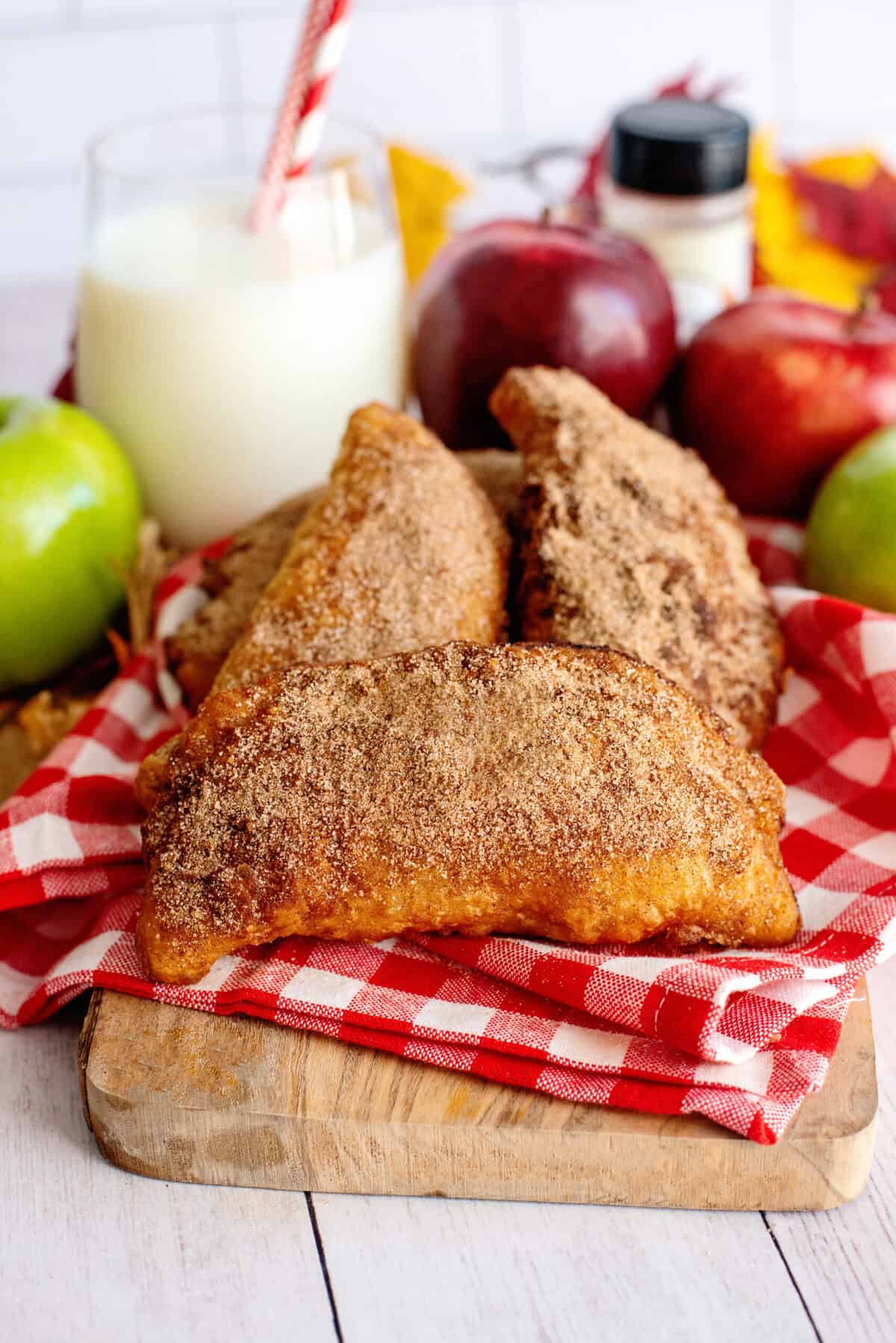 Fried apple hand pies on a serving board
