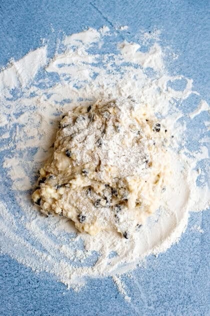 Chocolate chip biscuit dough on a floured surface