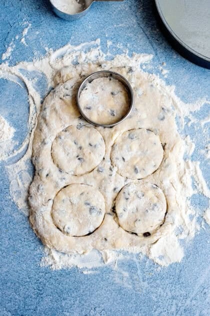 Cutting rounds out of the chocolate chip biscuit dough