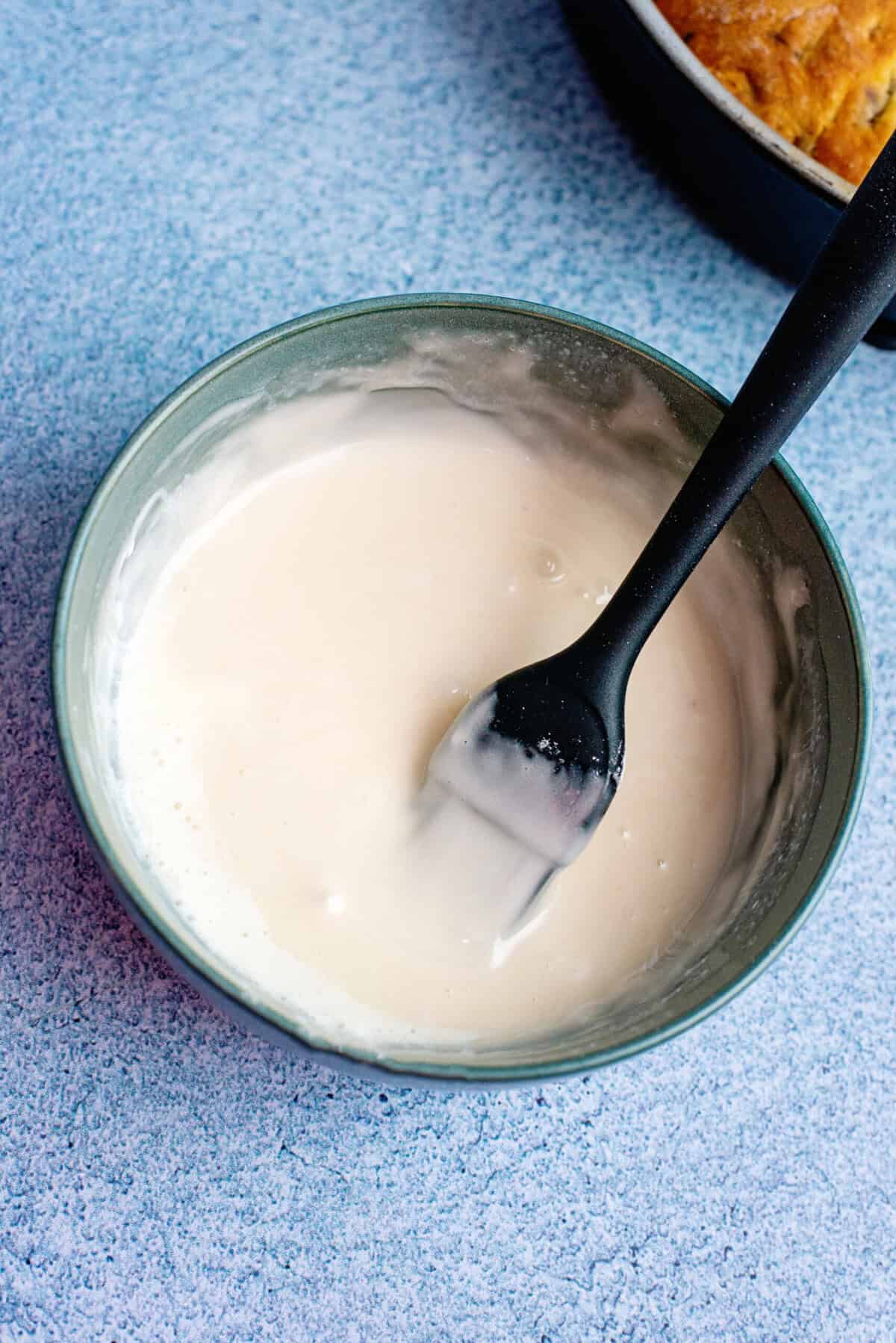 A small bowl of the chocolate chip biscuit glaze