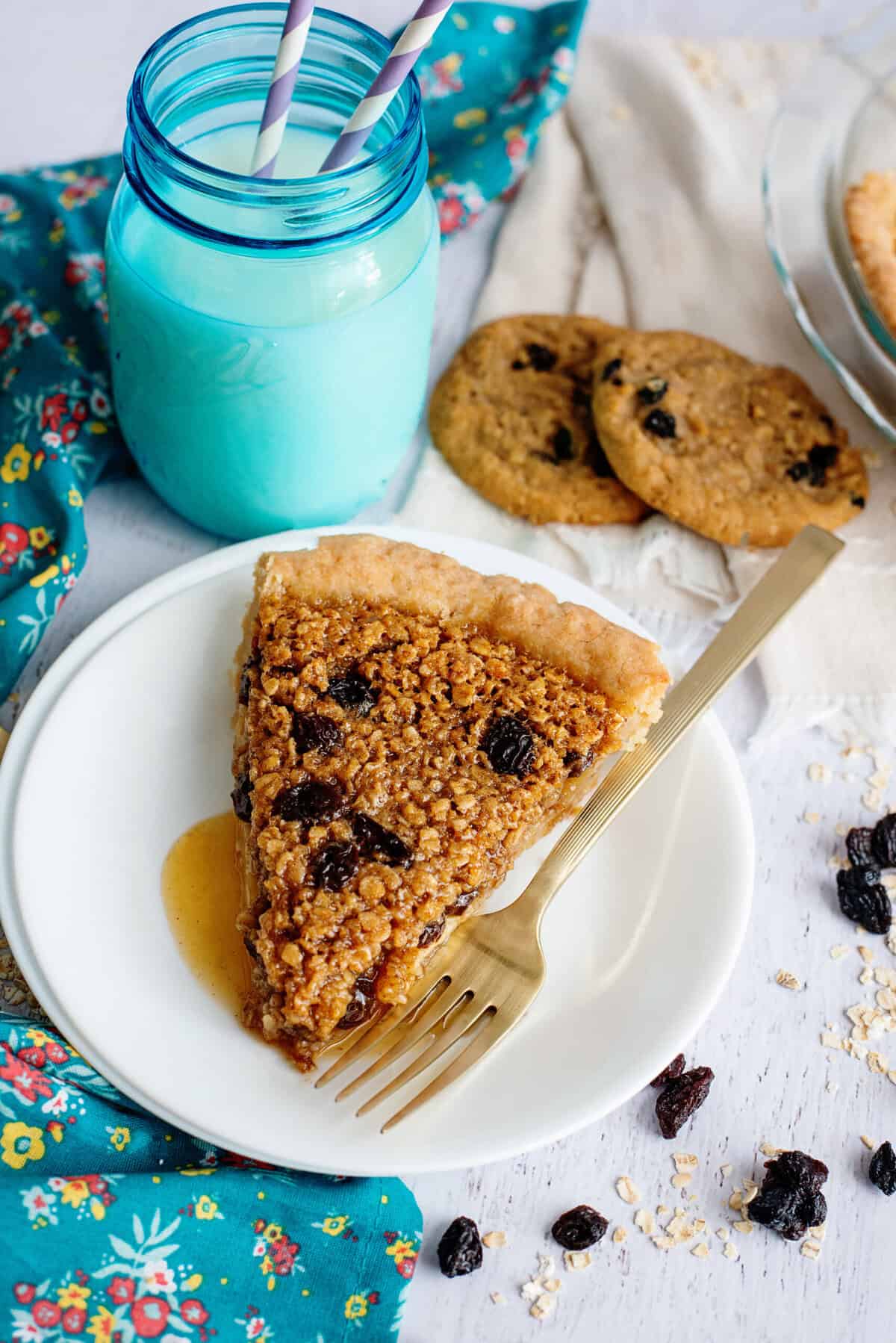 A plate with a slice of oatmeal raisin cookie pie