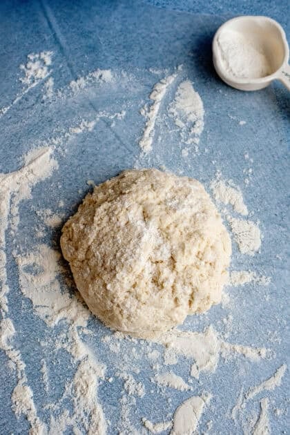 Easy homemade biscuit dough with flour sprinkled over it