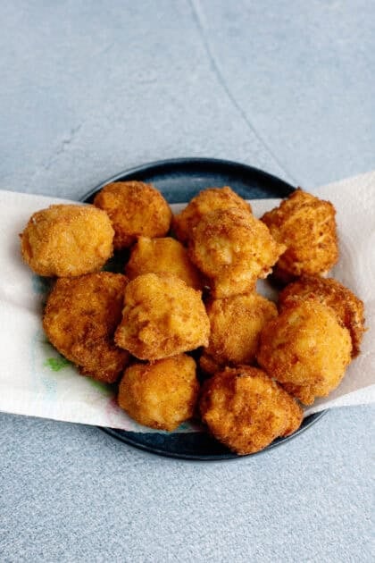 Fried mac and cheese balls on a paper towel